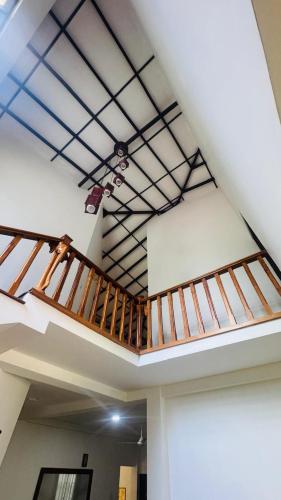 a room with twoadders on the ceiling of a building at Ceylon Mist Villa in Narandanda