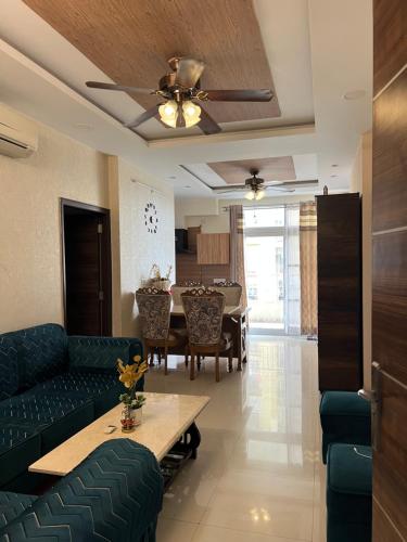 a living room with a couch and a table at Casa Luxoria in Jalandhar