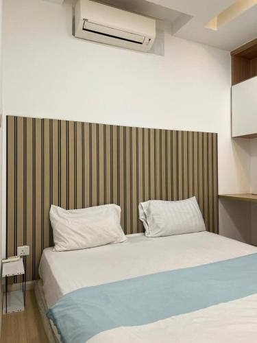 a bedroom with a large bed with two pillows at Damansara#IOI Mall Damansara #Sunway Nexis#Golf course Sunset view in Petaling Jaya