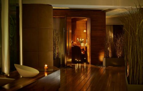 a lobby with a person sitting in a chair at a desk at Killarney Plaza Hotel & Spa in Killarney