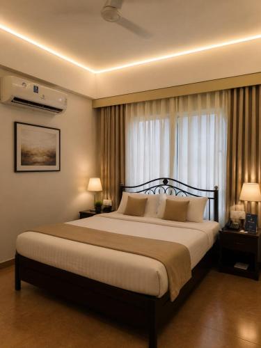 a bedroom with a large bed in front of a window at Chillout Villa in Wada
