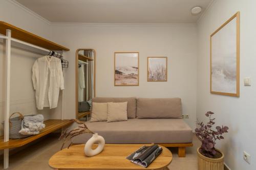 a living room with a couch and a table at Cavaliere Seafront House - Theseus in Sami
