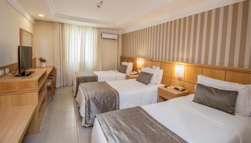Cama o camas de una habitación en Hotel Astoria Palace