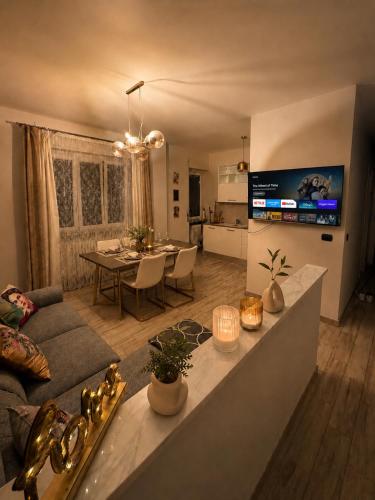 a living room with a couch and a table at Oasi Domese Appartamento Centrale in Domodossola