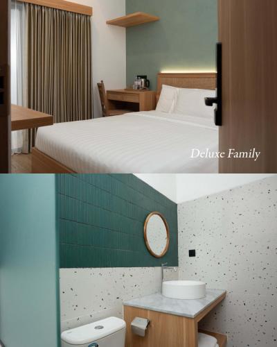 a hotel room with a bed and a bathroom at Griya Yunika in Yogyakarta