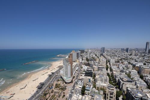 an aerial view of a city and the beach at Superb Beachfront Apartments with Shelter by Sea N' Rent in Tel Aviv