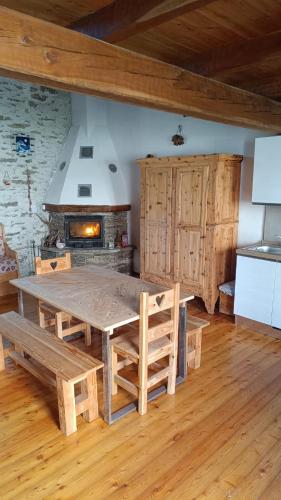 a kitchen with a large wooden table in a room at Locazione turistica Lou Bindel in Sampeyre