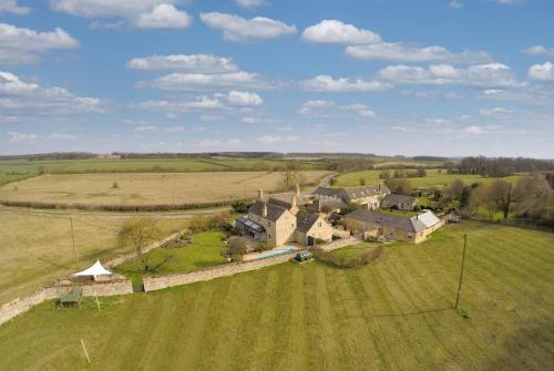 an aerial view of a large house in a field at Pea Cottage in Stamford