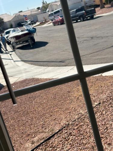a view from a window of a parking lot with a boat at EdCccc life in Las Vegas