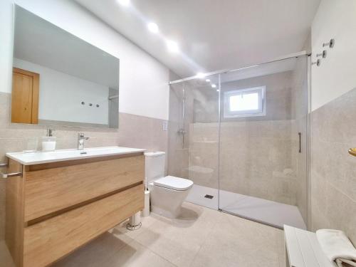 a bathroom with a toilet sink and a shower at Ca Na Luisa-Residential Area in Palmanova