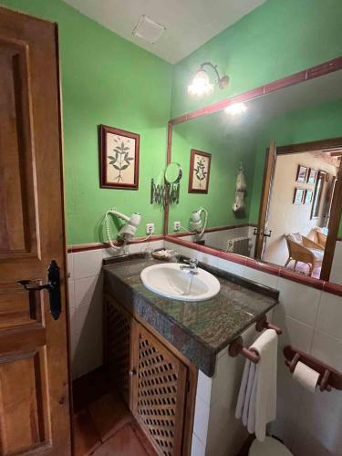a bathroom with a sink and a mirror at La Tejera de Fausto in Requijada