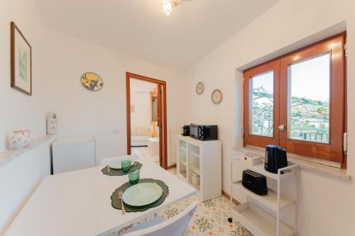 a room with a bed and a table in it at Casa degli Ulivi in Ravello