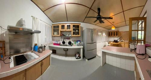 an overhead view of a kitchen with a ceiling at Lingkudau Homestay in Keningau
