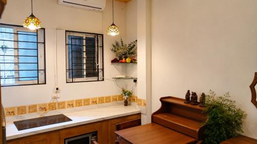 a kitchen with a sink and a counter top at Local Homestay in Hanoi