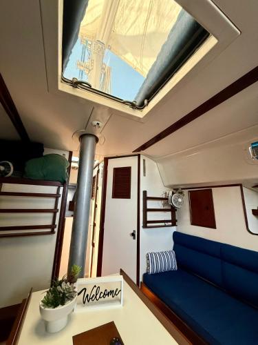 a small room with a blue couch and a bunk bed at Resort chic on the water! in Key West