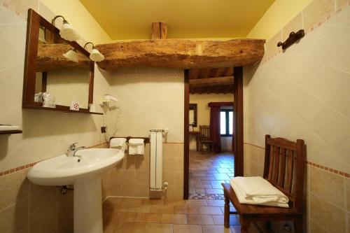 a bathroom with a sink and a toilet in it at Hotel Antico Casale in Vigarano Mainarda