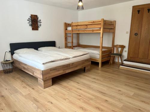 a bedroom with two bunk beds and a ladder at Haus Mader 3 in Riscone