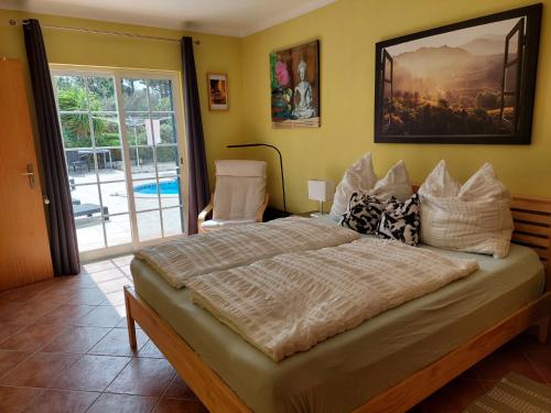 a bedroom with a large bed in a room at Villa Atlantico in Aljezur