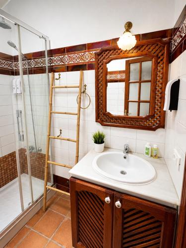 a bathroom with a sink and a shower at Deluxe Mogán Beach Apt 1 in Puerto de Mogán