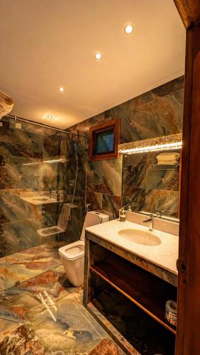 a bathroom with a sink and a toilet at Gatetrees resort in Jaffna