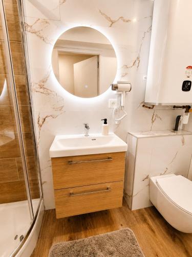 a bathroom with a sink and a shower at Cocon avec terrasse proche plages et centre in Dives-sur-Mer