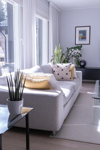 a living room with a couch and a table at Villa White Star in Rovaniemi