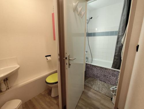 a bathroom with a toilet and a sink and a shower at Marla 52 in Le Dévoluy