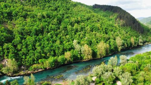 an aerial view of a river in a forest at Layal Residence Exclusive 2 Floor House with Terrace in Bihać