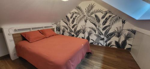 a bedroom with a bed and a wall mural at quiet house in Nogent-sur-Eure