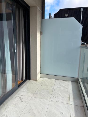 a sliding glass door on a balcony at Studio de standing in Malakoff