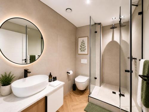 a bathroom with a sink and a mirror at On Park Luxury One Bed & Bath- in Cape Town