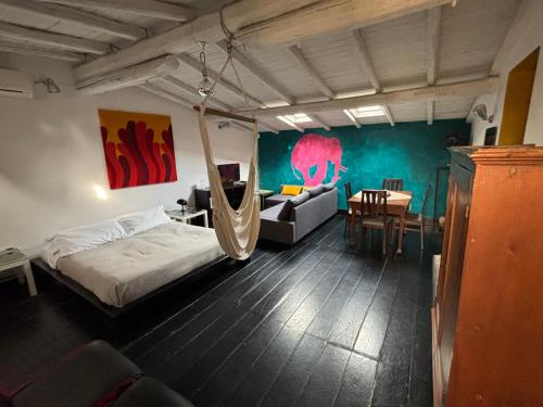a bedroom with a bed and a hammock in it at BAD - B&B And Design in Catania
