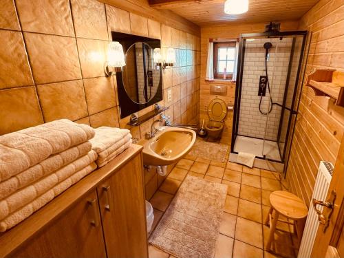 a small bathroom with a sink and a shower at Ferienhaus Unterkircher-Wallner in Heiligenblut
