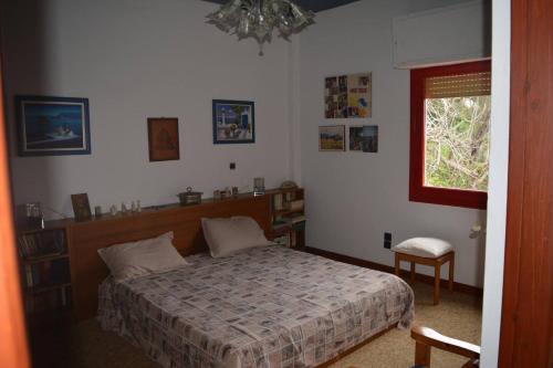 a bedroom with a bed and a window at La casa di Aurora - Room A - Boutique Hotel in Agios Ioannis Peristerion