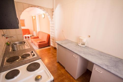 a kitchen with a sink and a stove in it at Private Apartments Stella Maris in Umag