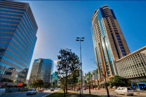 a city with tall buildings and a street with cars at Blue Tree Premium Faria Lima in São Paulo