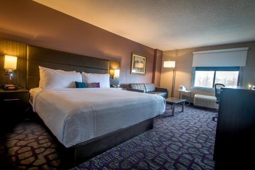 a hotel room with a large bed and a window at Comfort Inn Largo-Washington DC East in Upper Marlboro
