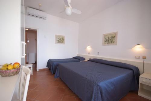 Postel nebo postele na pokoji v ubytování Hotel Dino