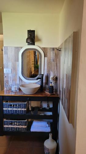 a bathroom with a sink and a mirror at Namasté in Villa Larca