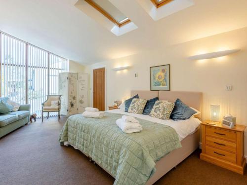 a bedroom with a large bed with towels on it at 2 Bed in Wells oc-46310 in Wells