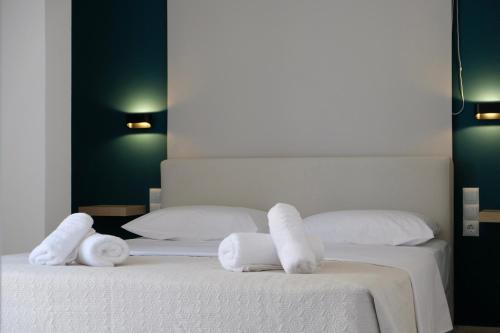 two towels on two beds in a room at Evia Blue Aura in Khrónia