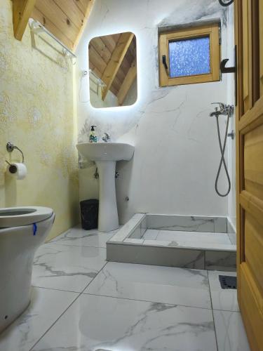 a bathroom with a sink and a tub and a toilet at Camp Magic View in Mojkovac