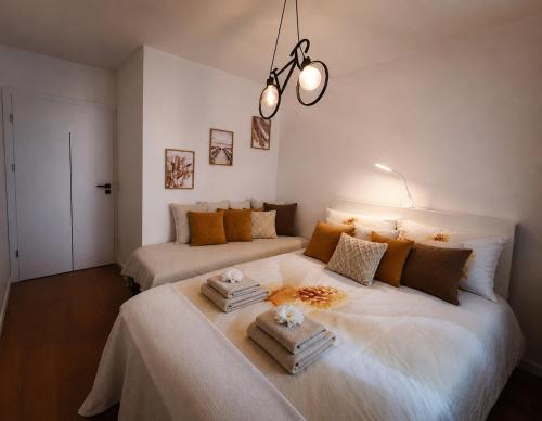 a bedroom with two beds in a room at Apartament Pod Modrzewiem in Augustów