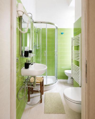 a bathroom with a sink and a shower and a toilet at Il Quadrifoglio guesthouse in La Spezia