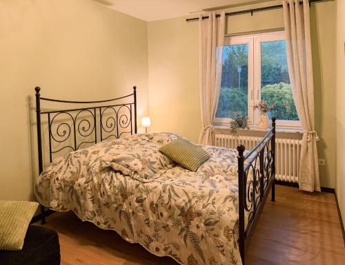 a bedroom with a bed and a window at TheSlowMorningNo1 in Cuxhaven