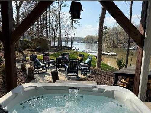 a bath tub with a view of a lake at High Rock Haven in Lexington