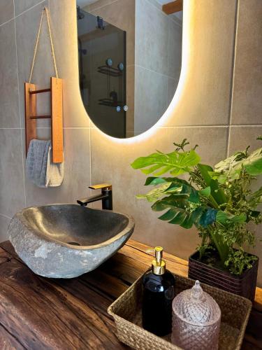 a bathroom with a bowl sink and a mirror at Green Hills - Holiday Home & Events in Kamenica