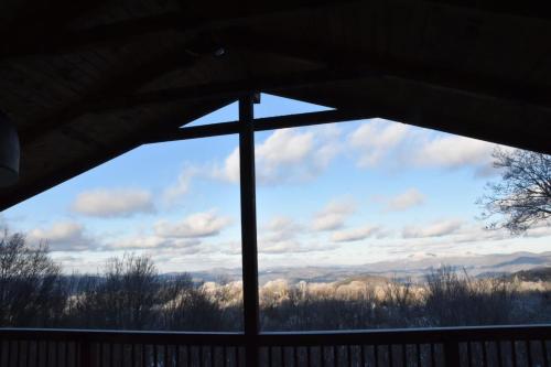 a view from a window of a cross at Paws at the Peak in Beech Mountain