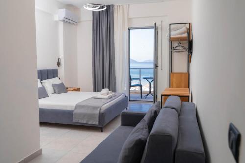 a hotel room with a bed and a couch at Maor Hotel in Vlorë