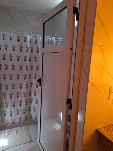 a shower with a glass door in a bathroom at El Belichito in Belén